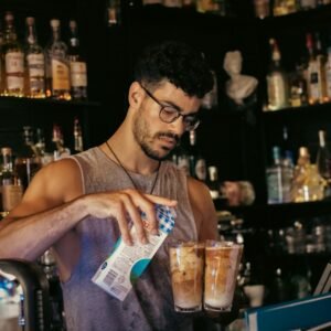 a man holding a bottle of alcohol